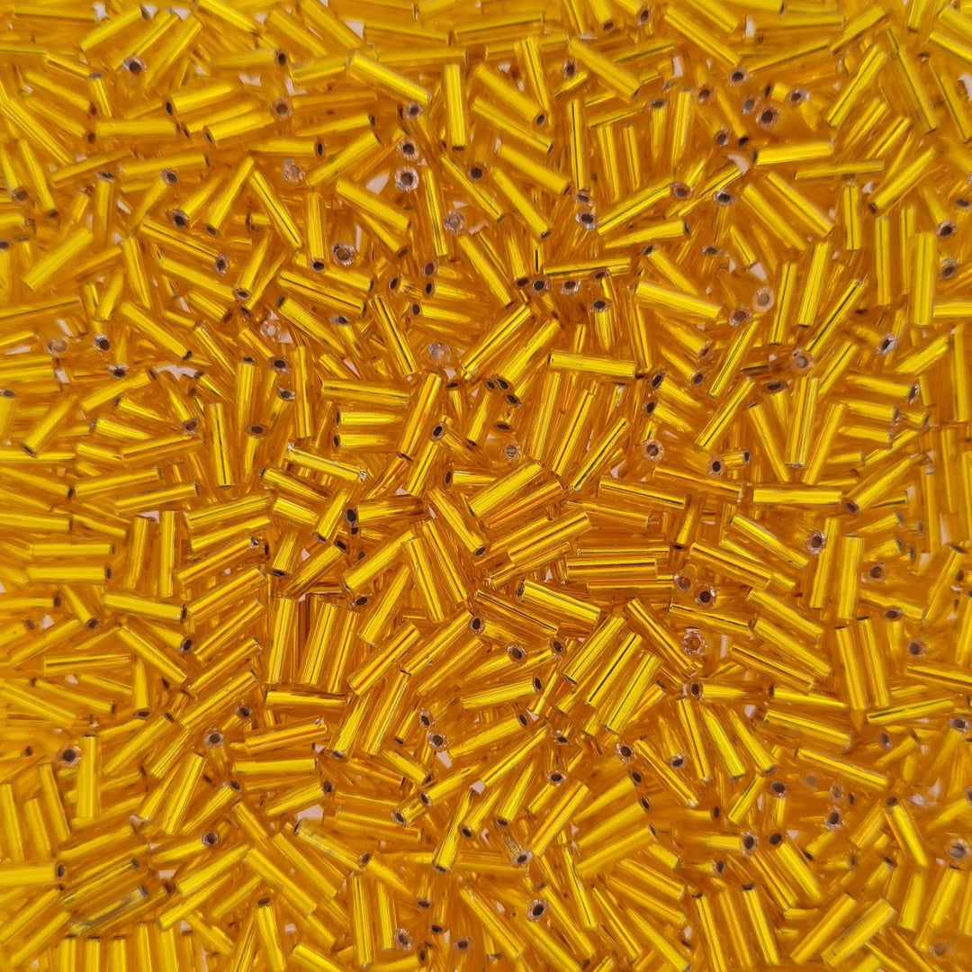 Guld glasperler, preciosa cut bugles, silverlined yellow, 6,8 mm Preciosa BOC